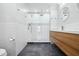 Modern bathroom featuring a glass enclosed shower, wood vanity and dark floors at 121 Dolly St, Punta Gorda, FL 33950