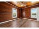 Bedroom featuring wood ceiling, walls and floors along with a ceiling fan at 121 Dolly St, Punta Gorda, FL 33950