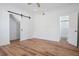 Bedroom features sliding barn door closet, and access to the bathroom at 121 Dolly St, Punta Gorda, FL 33950