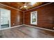 Bedroom featuring wood ceiling, walls and floors along with a shower at 121 Dolly St, Punta Gorda, FL 33950