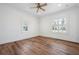 Sunny bedroom offers wood-look floors and dual windows for natural light at 121 Dolly St, Punta Gorda, FL 33950