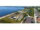 An aerial photo of a waterfront community park featuring a playground, parking, and walking paths along the water at 121 Dolly St, Punta Gorda, FL 33950