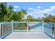 Outdoor deck with painted wood floor and railings offering nice views at 121 Dolly St, Punta Gorda, FL 33950