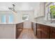 Modern kitchen featuring wood cabinets, stainless steel appliances, bright countertops, and a large island at 121 Dolly St, Punta Gorda, FL 33950