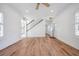 Bright living room with stairs and hardwood flooring, leading to other rooms at 121 Dolly St, Punta Gorda, FL 33950