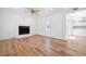 Spacious living room with wood floors, a fireplace, recessed lighting and views to the kitchen at 121 Dolly St, Punta Gorda, FL 33950