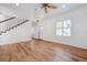 Bright living room with stairs and hardwood flooring, exuding a modern aesthetic at 121 Dolly St, Punta Gorda, FL 33950