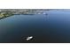 A broad water view featuring a boat in the distance, a marina, and the city skyline on the horizon at 121 Dolly St, Punta Gorda, FL 33950