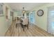 Comfortable dining room featuring a large window with a view and a stylish light fixture at 1231 Pine Needle Rd, Venice, FL 34285