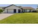 Charming one-story home with well-maintained lawn and inviting curb appeal at 1231 Pine Needle Rd, Venice, FL 34285