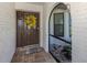 Inviting front entrance featuring a decorative wreath and tiled entryway at 1231 Pine Needle Rd, Venice, FL 34285