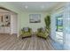 Cozy sitting area with two chairs, a small table, and a view of the outdoors at 1231 Pine Needle Rd, Venice, FL 34285
