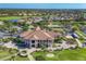 Aerial view of the golf course community showcasing lush landscaping and serene lake views at 1241 Creek Nine Dr, North Port, FL 34291