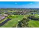 Wide aerial perspective capturing an entire golf community, showcasing the lush course and residences at 1241 Creek Nine Dr, North Port, FL 34291