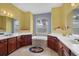 Bathroom features dual sinks, soaking tub and ceramic tile at 1241 Creek Nine Dr, North Port, FL 34291