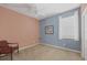 Cozy bedroom with a ceiling fan and light-filled window provides a relaxing space at 1241 Creek Nine Dr, North Port, FL 34291