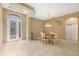 Inviting dining room features tile flooring, natural light, and space for Gathering gatherings at 1241 Creek Nine Dr, North Port, FL 34291