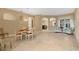 Open-concept dining room showcasing tile floors, natural light, and versatile living space at 1241 Creek Nine Dr, North Port, FL 34291