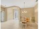 Dining room showcasing tile floors, light fixture, and entry door to outside at 1241 Creek Nine Dr, North Port, FL 34291