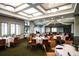 Spacious event space with elegant table settings, ideal for hosting special occasions and celebrations at 1241 Creek Nine Dr, North Port, FL 34291