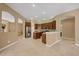 Spacious kitchen featuring dark wood cabinets, stainless steel appliances, and tile floors at 1241 Creek Nine Dr, North Port, FL 34291