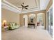 Spacious living room features trey ceiling, neutral walls and tiled floor at 1241 Creek Nine Dr, North Port, FL 34291
