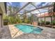 Sparkling pool with covered lanai offers a refreshing escape in a lush, private setting at 1241 Creek Nine Dr, North Port, FL 34291