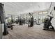 Well-equipped fitness center with modern machines, natural light, and a spacious layout for a complete workout experience at 12418 Asana Ct, Venice, FL 34293