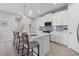 Bright kitchen showcasing a quartz countertop island, stainless steel appliances, and elegant pendant lighting at 12418 Asana Ct, Venice, FL 34293