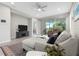 Comfortable living room with a large sectional sofa and a screened patio at 12418 Asana Ct, Venice, FL 34293