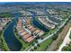 Aerial view of homes surrounding a lake in a beautiful residential community at 13150 Huerta St, Venice, FL 34293