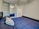Bedroom with a cozy blue comforter and mirrored closet doors reflecting the room's interior at 13150 Huerta St, Venice, FL 34293