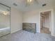Cozy bedroom with neutral walls, carpet, ceiling fan, and mirrored closet doors at 13150 Huerta St, Venice, FL 34293