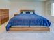 Bedroom featuring a wooden bed frame, light walls and plush carpeting at 13150 Huerta St, Venice, FL 34293
