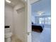 View into the bedroom with plantation shutters and soothing blue color scheme at 13150 Huerta St, Venice, FL 34293