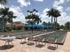 Bocce ball courts at a community center, complete with tables, chairs, and shade at 13150 Huerta St, Venice, FL 34293