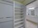 Spacious walk-in closet providing ample storage space and convenient access to the Primary bathroom at 13150 Huerta St, Venice, FL 34293