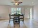 Dining area featuring plantation shutters, providing ample natural light and creating a cozy atmosphere at 13150 Huerta St, Venice, FL 34293