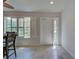 A charming dining area, tile flooring and white front door for great curb appeal at 13150 Huerta St, Venice, FL 34293
