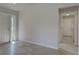 Entryway with tile flooring and a view of the front door and hallway leading to laundry area at 13150 Huerta St, Venice, FL 34293