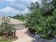 Charming home exterior featuring a well-maintained lawn and landscaping, enhancing curb appeal at 13150 Huerta St, Venice, FL 34293