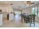 Open floor plan kitchen featuring tile floors and granite countertops at 13150 Huerta St, Venice, FL 34293