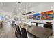 Open floor plan featuring a dining area connected to a modern kitchen and living space at 13511 Esposito St, Venice, FL 34293