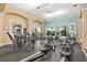 Well-equipped gym with modern exercise machines, ceiling fan, and plenty of natural light at 13511 Esposito St, Venice, FL 34293