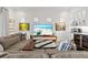 Comfortable living space with a large TV, built-in bar, and stylish decor at 13511 Esposito St, Venice, FL 34293