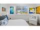 Serene bedroom features a comfortable bed, waterfront views, and elegant decor at 13511 Esposito St, Venice, FL 34293