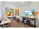 Functional office space with modern decor, sewing machine, and a comfortable seating area, great for creatives at 13511 Esposito St, Venice, FL 34293
