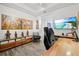 Bright office space featuring built-in shelving, desk, and a TV for a comfortable work environment at 13511 Esposito St, Venice, FL 34293