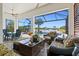Inviting outdoor patio with comfortable seating and scenic views of the pool and the lake at 13511 Esposito St, Venice, FL 34293