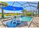 Relaxing pool area with chaise lounges and pond view at 13511 Esposito St, Venice, FL 34293
